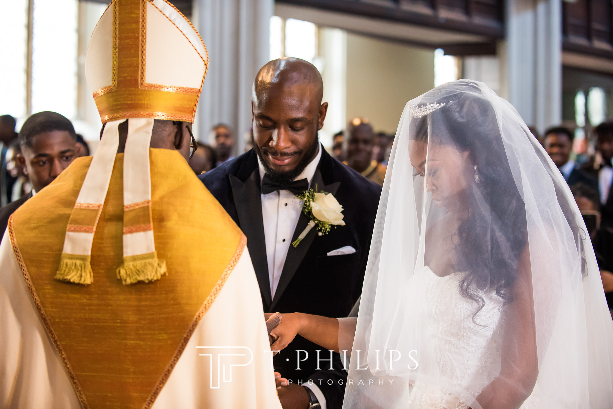 black man and woman at alter with bishop