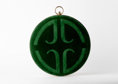 Emerald green round clasp clutch